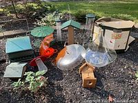 Wide view of all feeders and guards showing variety and materials