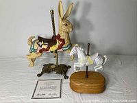 Porcelain carousel rabbit figure, horse music box on wood base, Certificate of Authenticity displayed