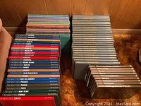 Stack of Time-Life books from The Great Cities series with colorful spines arranged on a carpeted surface.