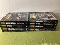 Photo of all 14 Time-Life American Musicals LP boxed sets stacked in two rows showing spines, showcasing various composers and titles included.