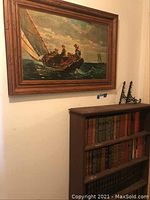Painting of sailors on sailboat above wooden bookcase and brackets