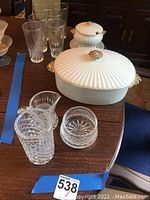 Photo showing Waterford crystal pieces and white ceramic ovenware dishes on table