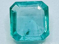 Top view of emerald showing square emerald cut and clarity