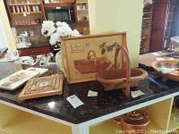 Wooden serving ware including foldable basket and packaging box on kitchen counter