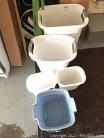 Top view and side view of 5 assorted plastic pails showing white and light blue colors, different sizes and handle styles.