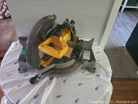 Overall view of the Dewalt miter saw on a table