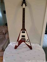 Full front view of guitar showing body shape and finish