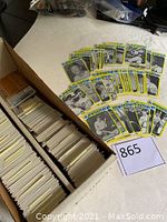 Photo of wide box with sorted baseball cards; 1980 TCMA Superstars cards spread on top