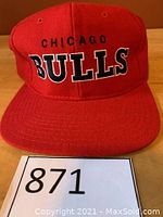 Front view of red Chicago Bulls wool snapback cap with embroidered logo.