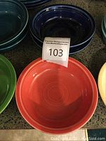 13 Fiesta Ware ceramic cereal bowls in a variety of colors including turquoise, cobalt, juniper, yellow, tangerine, and shamrock.