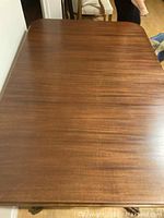 Rectangular antique wooden dining table top with a smooth finish and visible wood grain pattern