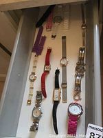 First drawer view showing ten assorted women’s watches with silicone, leather and metal straps