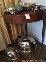 Overall view of small and large domes on floor and nesting trays with lattice basket on table
