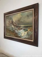 Framed oil painting by Engel depicting coastal scene with boats, seagulls, and rocky shoreline.