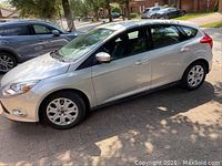 Silver Ford Focus side profile showing body panels and alloy wheels