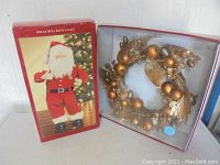 Box of Jingle Bell Rock Santa figure showing packaging and figurine photo
