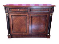 Front view of the mahogany Empire style buffet showing two drawers, two paneled cabinet doors with gold-accented fluted columns on sides.