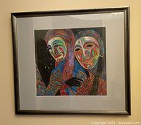 Framed original colorful tribal women artwork by Bartenev on black background in black frame.