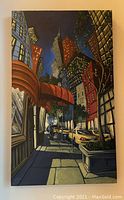 Front view of the original New York streetscape painting showing city street, buildings, taxi, trees, and shadows under late light conditions.