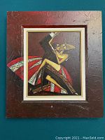 Photo of framed romantic dance painting, showing textured surface, couple dancing in formal wear, red dress, black suit, in reddish brown frame.