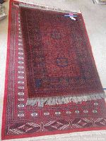 Overlapping view of both rugs laid on floor showing full patterns