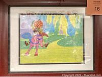 Framed animation cel featuring pumpkin-headed character and girl on pink horse, showcasing full framed artwork and size.