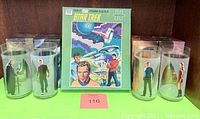 Display of the complete set including the Star Trek Guild 200-piece puzzle with colored character and starship artwork and four collectible Star Trek: The Movie glasses with character images inside original boxes.