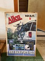 Front of Allen 103A bike rack original box with images of bike rack attached to vehicle carrying two bikes.