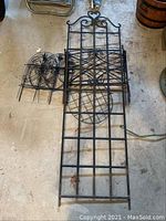 Large garden trellis with four smaller garden borders arranged on ground to show size and design.