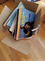 Box of vintage vinyl records including a clear view of Richie Havens "Mixed Bag" album cover among others.