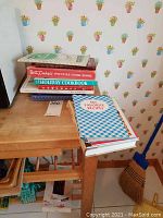 Stack of vintage cookbooks including Betty Crocker's Picture Cookbook and Holiday Cookbook, showing worn condition and variety of sizes.