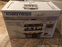 Box front of Toastess Silhouette stainless steel food steamer & rice cooker with image and key features.