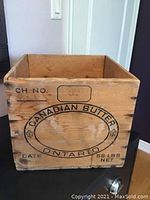 Front side of the wooden butter box showing Canadian Butter Ontario emblem and markings.