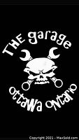 Logo of The Garage, Ottawa Ontario, featuring a skull with crossed wrench tools.