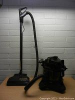 Overall assembled vacuum with power nozzle, wand and hose