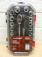 Front view of Husky 24 piece socket and ratchet set in clear plastic case, showing arrangement of tools including ratchet and sockets.