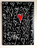 Front view of graffiti-style heart painting on black wood board with rustic wood frame showing white hearts and a central red heart.