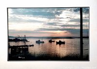 Framed photographic print showing a tranquil harbor with boats at sunset, signed and dated by Peter Li in the lower left corner.