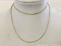 Front view of rope chain draped on display bust