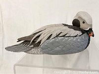 Side view of the DJ Bolduc duck decoy showing detailed feather paint and carving.