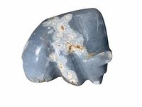 Close-up view of the front and side profile of the carved blue stone bear fetish showing its polished surface and natural stone inclusions.