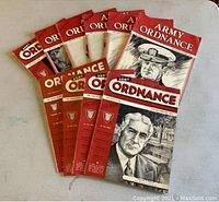 Ten issues of Army Ordnance magazine spread out on a surface, showing varied cover illustrations featuring military leaders from the 1940s.