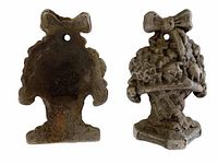 Front and side views of both flower basket doorstops/bookends showing detailed design and shape.