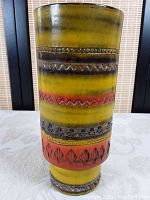 Full front view of the MCM pottery vase showing colors and embossed bands.