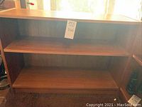 Front view of one bookshelf showing two shelves and overall structure