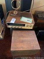 Overall view of Sherwood receiver atop speaker cabinet