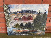 Full view of the painting showing winter farm scene with red barns and snowy landscape against a brick wall.