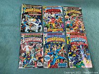 Photo showing full lot of six Guardians of the Galaxy comic books from 1976 by Marvel, displaying cover art and arrangement.