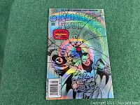 Front view of Fantastic Four issue 400 comic with holographic cover on green background