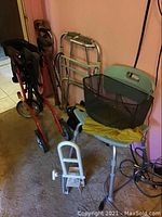 Overview of all items showing mobility aids including walkers, rollator, and shower chair with basket